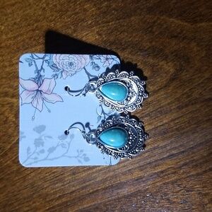 Silver costume earrings, new